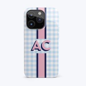 May include: A blue and white gingham phone case with a pink and navy blue stripe down the center. The initials "AC" are printed in pink on the case.