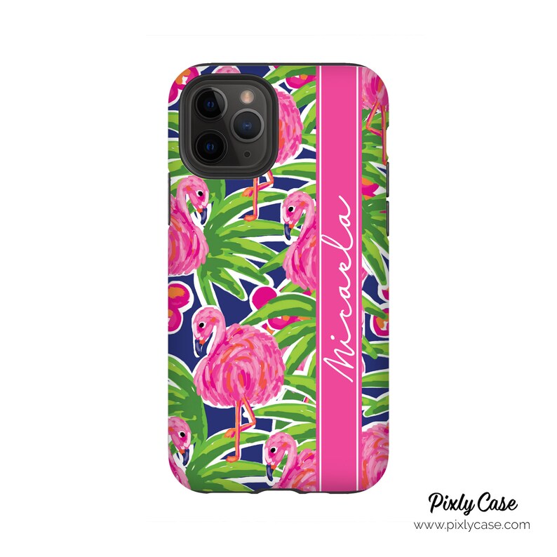 May include: A pink and blue phone case with a flamingo pattern and the name "Michaela" printed on the side.