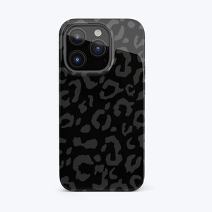 May include: Black phone case with a leopard print design. The case has a raised camera bump and a glossy finish.