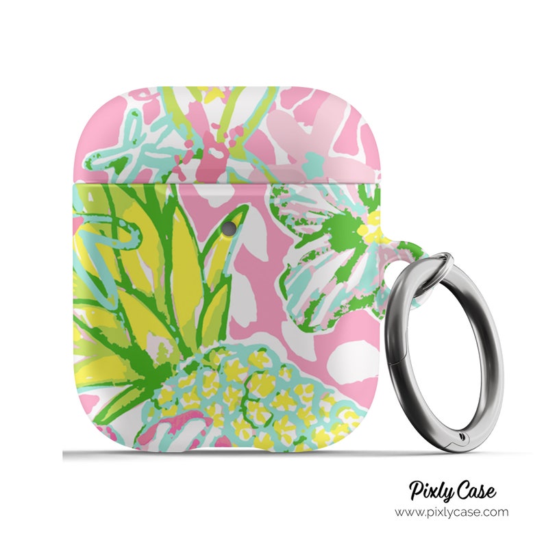 May include: A pink, white, green, and blue floral print Airpods case with a silver metal ring attached. The case has a floral pattern with pineapples and flowers. The text "Pixly Case" and "www.pixlycase.com" is printed on the bottom of the image.