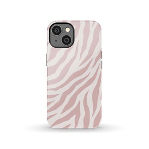May include: A pink and white zebra print phone case for an iPhone.