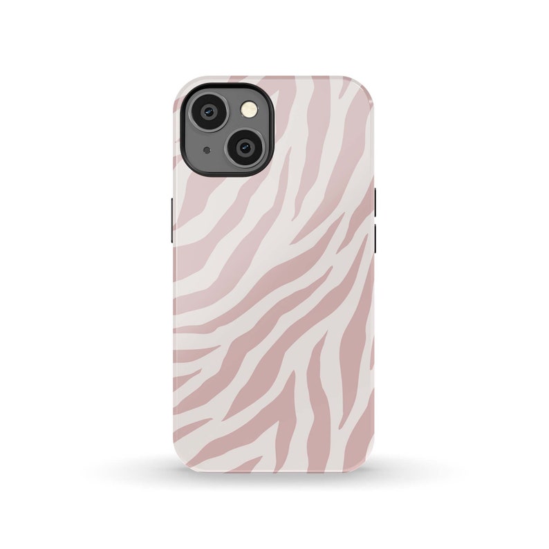 May include: A pink and white zebra print phone case for an iPhone.