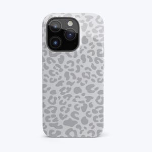 Könnte beinhalten: Eine weiße iPhone-Hülle mit einem grauen Leopardenmuster.