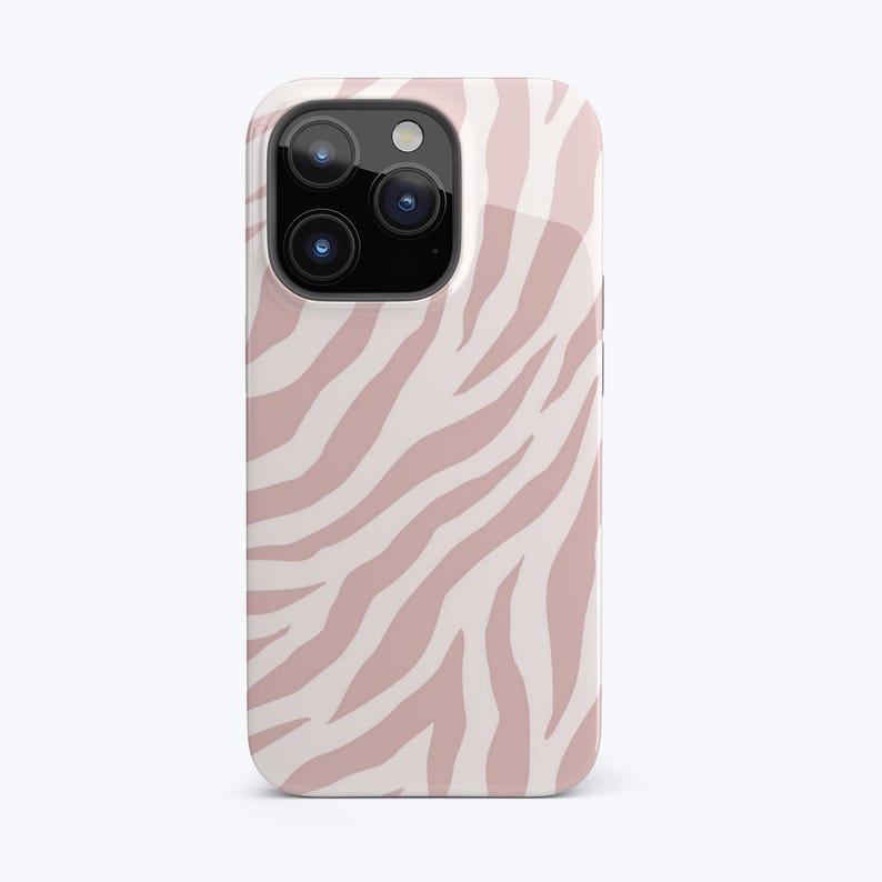 May include: A pink and white zebra print phone case for an iPhone.