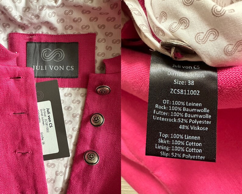 May include: A pink dirndl dress with a black label that says "Juli von CS" and the size "38". The label also lists the fabric composition of the dress, including linen, cotton, and polyester.