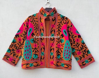May include: A brown jacket with a high collar and long sleeves. The jacket is embroidered with colorful floral and peacock designs. The text "Fashionandfurnish" is visible on the front of the jacket.