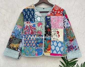 May include: A colorful patchwork jacket with a V-neck and button closure. The jacket is made of cotton and has a quilted design. The fabric is a mix of blue, green, pink, and orange.