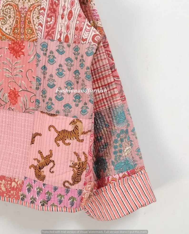 May include: A pink and white patchwork quilt with a floral and tiger print. The quilt is made of cotton and is hand-stitched. The quilt is perfect for adding a touch of bohemian style to your home.