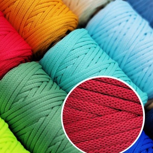 May include: A selection of colourful macrame cord spools, including yellow, red, green, blue, and teal. A circular inset highlights the texture and colour of the red cord. The image showcases a variety of crafting supplies for creative projects.