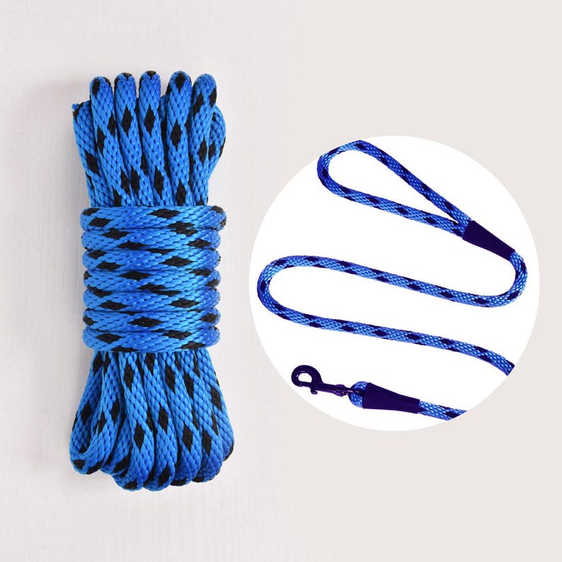 May include: A coiled blue rope with black accents and a matching blue leash with a metal clasp. The rope is tightly wound, and the leash has a loop handle. The items are set against a plain background.
