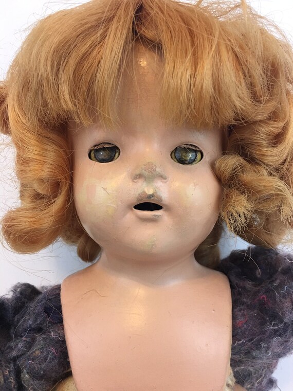 old doll with red hair