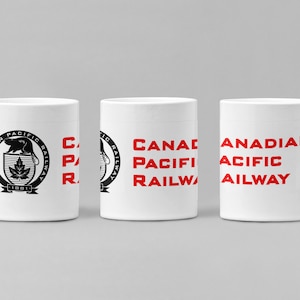 May include: Three white ceramic mugs featuring the Canadian Pacific Railway logo. The logo depicts a beaver, a maple leaf, and the text "Canadian Pacific Railway 1881".