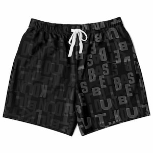 May include: Black shorts featuring a repeating text pattern in a darker shade. The shorts have a white drawstring and an elasticated waistband. The overall design is a dark, monochromatic style.