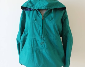 May include: Teal blue hooded jacket with a zipper closure and a Nike logo on the front.