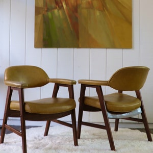 Vintage Mid-Century Hon Chairs/Set 2 MCM Wooden Frame Chairs/Upholstered in Mustard Vinyl adding charm to a living, dining, or office space.
