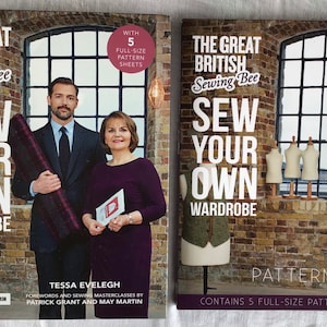 May include: Two books titled "The Great British Sewing Bee: Sew Your Own Wardrobe" and "Pattern Pack". The first book features a man and woman, the second shows dress forms. Both have text and are set against a brick wall background.