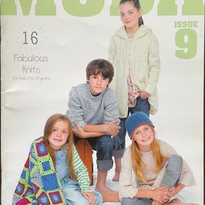May include: Magazine cover of "MODA", Issue 9, with children modelling knitwear. The cover text reads "16 Fabulous Knits for Kids 2 to 10 years." Children are wearing sweaters, a hooded cardigan, a beanie, and a colourful crocheted blanket.