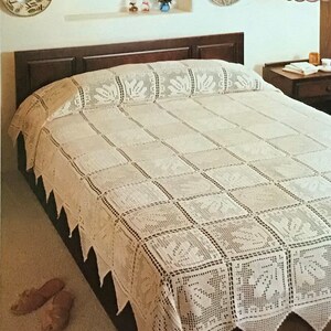 May include: A cream-colored, crocheted bedspread with a geometric pattern and leaf motifs. The bedspread measures 103 inches by 72 inches. The edges feature a scalloped trim. The text "Bedspread" is visible at the top of the image.