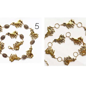 May include: Gold-toned metal belt featuring horse-shaped charms and oval accents. The belt has a chain closure and is displayed on a white background. The horse charms are in various poses, adding a dynamic element to the accessory.