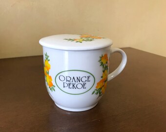 The Toscany Collection Orange Pekoe Coffee Mug with Lid, Toscany Collection Lidded Coffee Cups Orange Floral