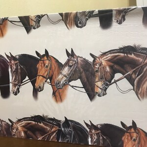 May include: A white background with a repeating pattern of brown and black horses with bridles. The horses are facing left and right, and their heads are tilted in different directions.