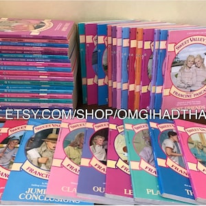 May include: A stack of 38 paperback books with pink, blue and green covers. The books are part of the Sweet Valley Twins series by Francine Pascal. The books have titles such as "Best Friends", "Center of Attention", "Jumping to Conclusions", and "The Mystery of the Missing Model".