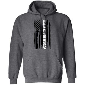 May include: A dark heather grey hooded sweatshirt with a distressed American flag design and the word "CHARLOTTE" in white lettering.