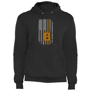 May include: Black hooded sweatshirt with a graphic of the American flag with a Bitcoin symbol in the middle.