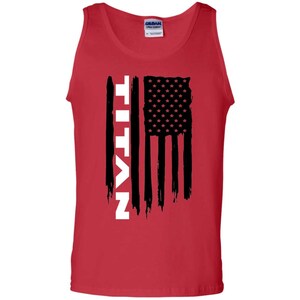 May include: Red tank top with a black and white American flag design and the word "TITAN" in white vertical lettering.
