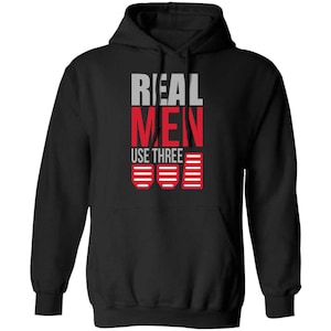 May include: Black hooded sweatshirt with the text "REAL MEN USE THREE" and a graphic of three red pedals with white stripes.