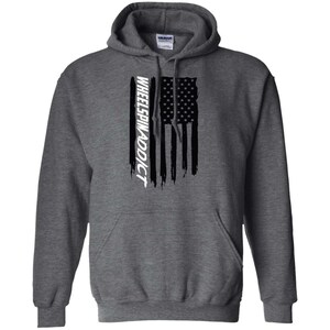 May include: A gray hooded sweatshirt with a black and white American flag design and the text "WHEELSPINADDICT" printed vertically on the left side of the flag.