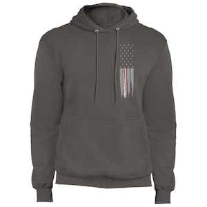 May include: A charcoal gray hooded sweatshirt with a distressed American flag design in gray and red on the front.