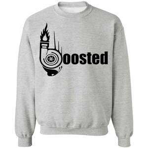 May include: A light gray crewneck sweatshirt featuring a black graphic print on the chest. The design incorporates a stylized turbocharger icon shaped like the letter B, with flames rising from the top, followed by the text "oosted".