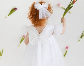 White open back linen baby girl dress, below knee tulle tutu gown with ribbon, lace outfit with short sleeves and feathers, backless dress