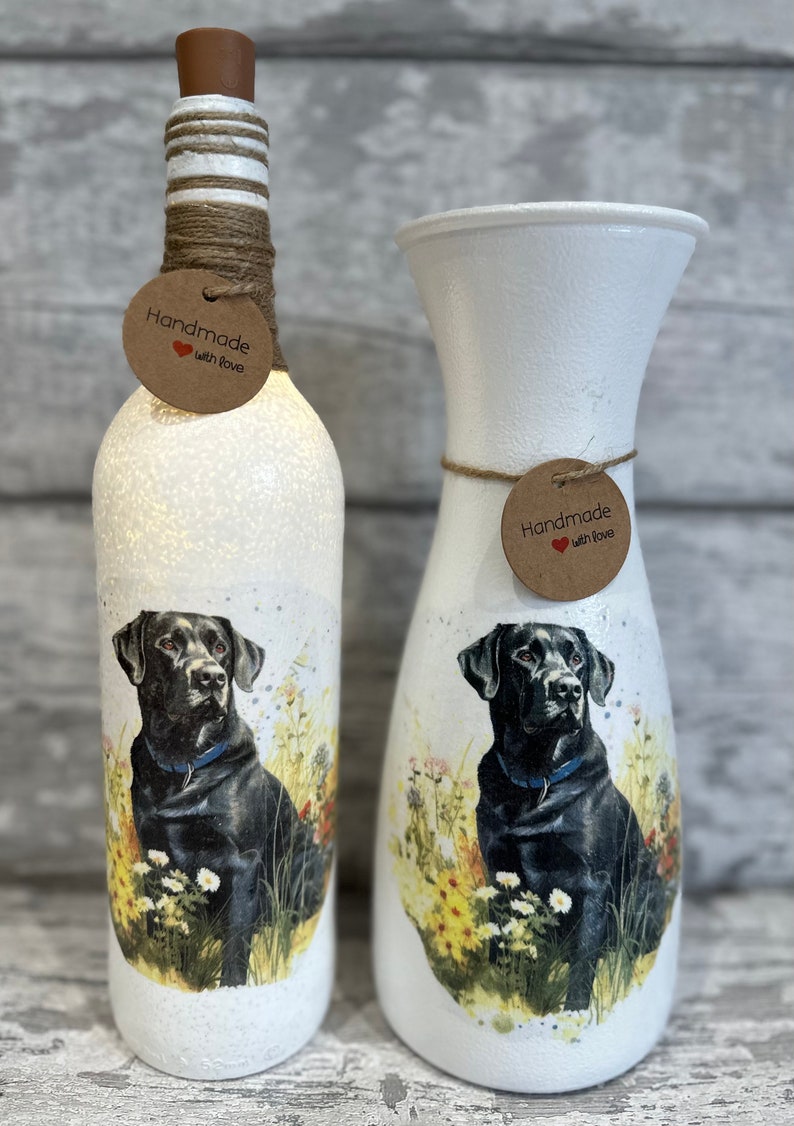 May include: Two white painted vases with a black Labrador Retriever design. The vases are decorated with twine and a brown tag that says "Handmade with Love".