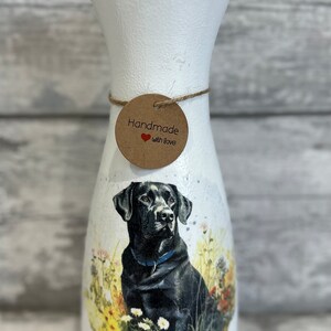 May include: White ceramic vase with a black Labrador Retriever image and a brown tag that says "Handmade with love".