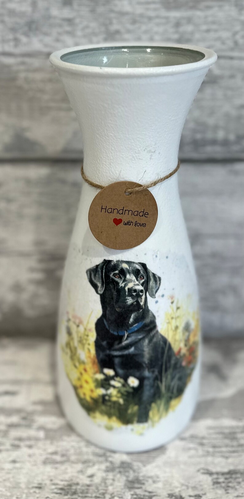 May include: White ceramic vase with a black Labrador Retriever illustration. The vase has a brown tag that says "Handmade with love".