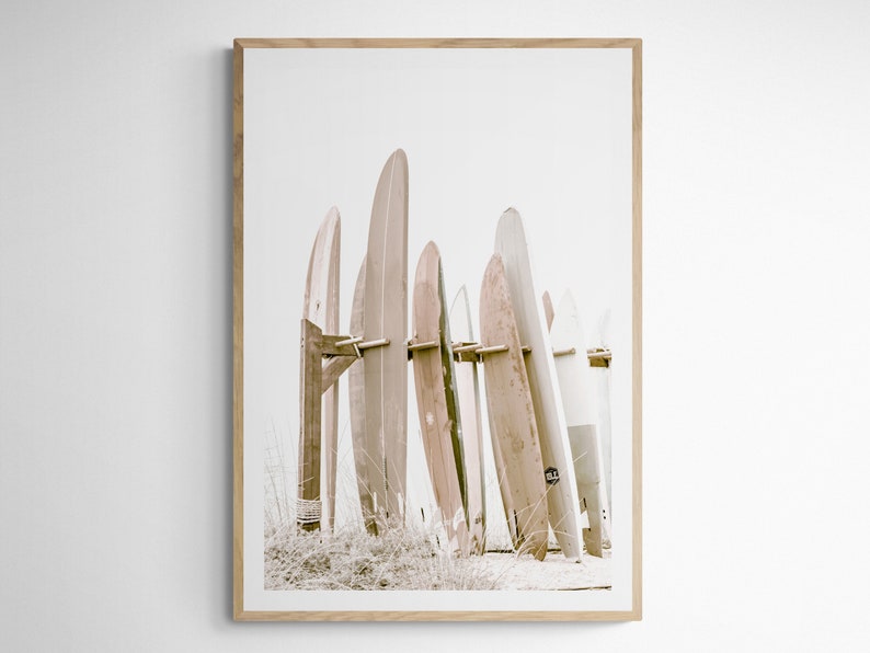 This is a sepia vertical photograph wall art print of surf boards at the iconic Hotel Del Coronado in San Diego, California. The sepia gives it a nostalgic feel.