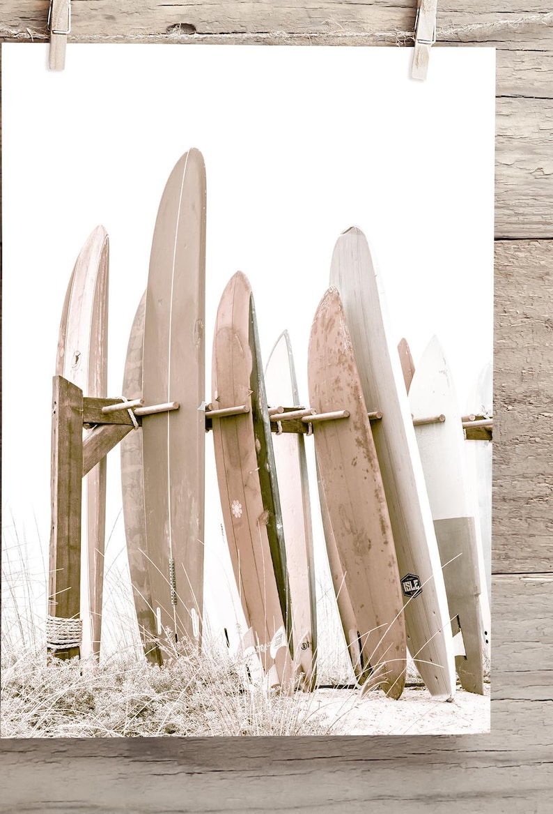 This is a sepia vertical photograph wall art print of surf boards at the iconic Hotel Del Coronado in San Diego, California. The sepia gives it a nostalgic feel.