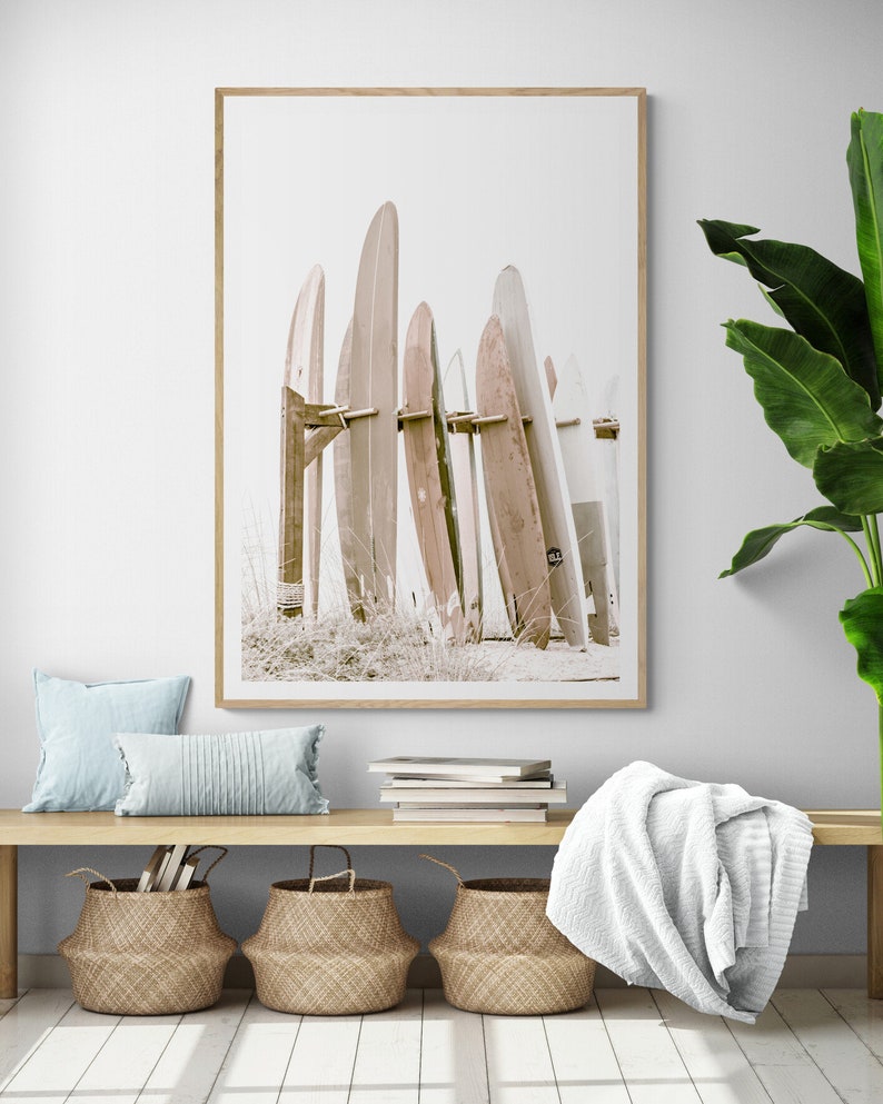 This is a sepia vertical photograph wall art print of surf boards at the iconic Hotel Del Coronado in San Diego, California. The sepia gives it a nostalgic feel.