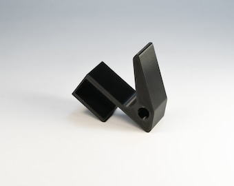 May include: A black plastic hook with a square base and a curved hook. The hook has a small hole in the center of the base.