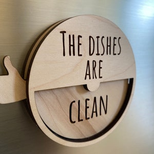 May include: A wooden sign with a thumbs up and the text "The Dishes Are Clean".