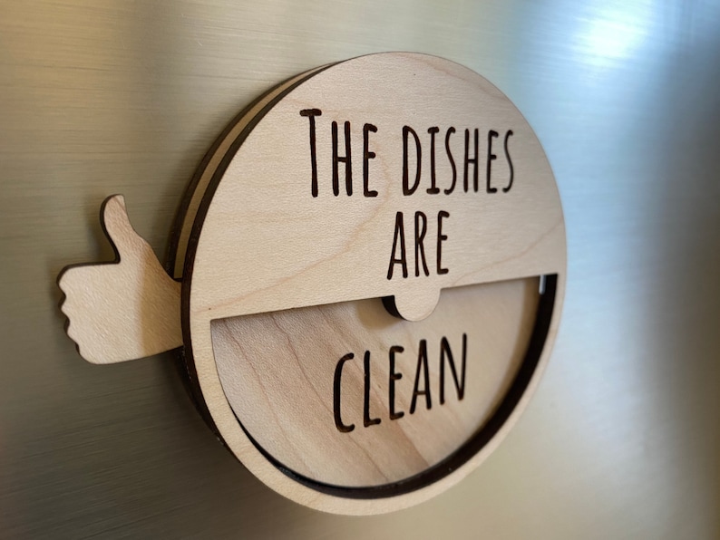 May include: A wooden sign with a thumbs up and the text "The Dishes Are Clean".