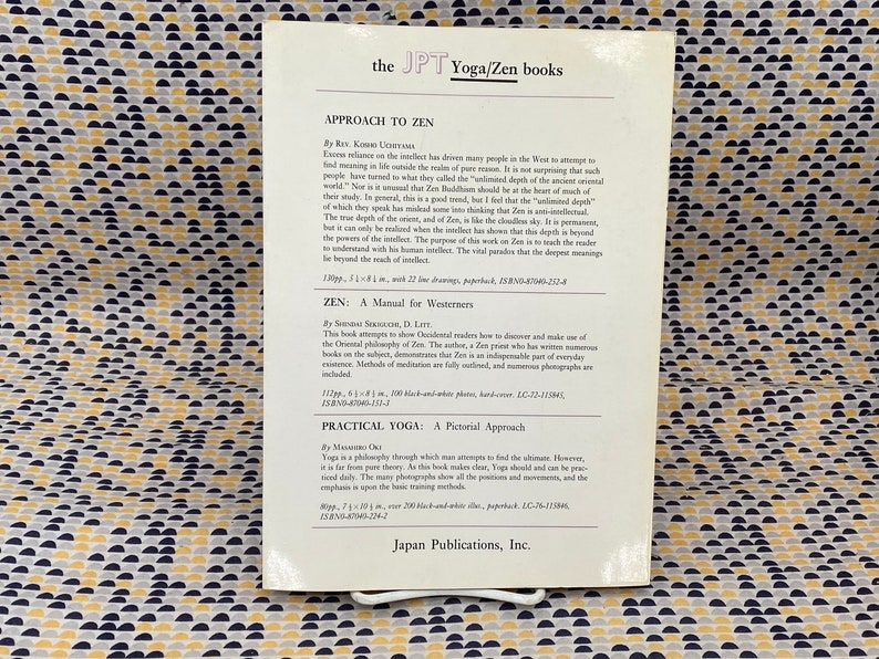 May include: A white book cover with black text describing three books on Zen and Yoga. The book titles are "Approach to Zen", "Zen: A Manual for Westerners", and "Practical Yoga: A Pictorial Approach".