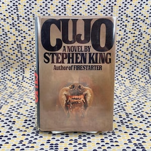 May include: A set of three ceramic mugs with a speckled, matte finish. Each mug features a different color: light blue, cream, and gray. The mugs have a simple, modern design and a comfortable handle.