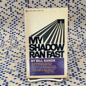 May include: A vintage paperback book titled "My Shadow Ran Fast" by Bill Sands. The cover features a black and white illustration of a doorway with a series of lines radiating outward. The book is a true crime story about a San Quentin ex-convict who fought his way up from degradation to become a fearless crusader in the war against crime.