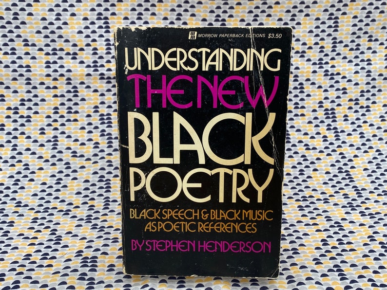 May include: A black paperback book titled "Understanding the New Black Poetry" by Stephen Henderson. The book cover features the title in large, white, bold letters with a pink "New" and a subtitle that reads "Black Speech & Black Music as Poetic References".