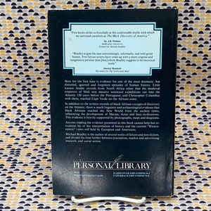 May include: The back cover of a paperback book titled "The Black Discovery of America" by Michael Bradley. The cover is dark with white text and includes quotes and a summary of the book's content. The book is from Personal Library.
