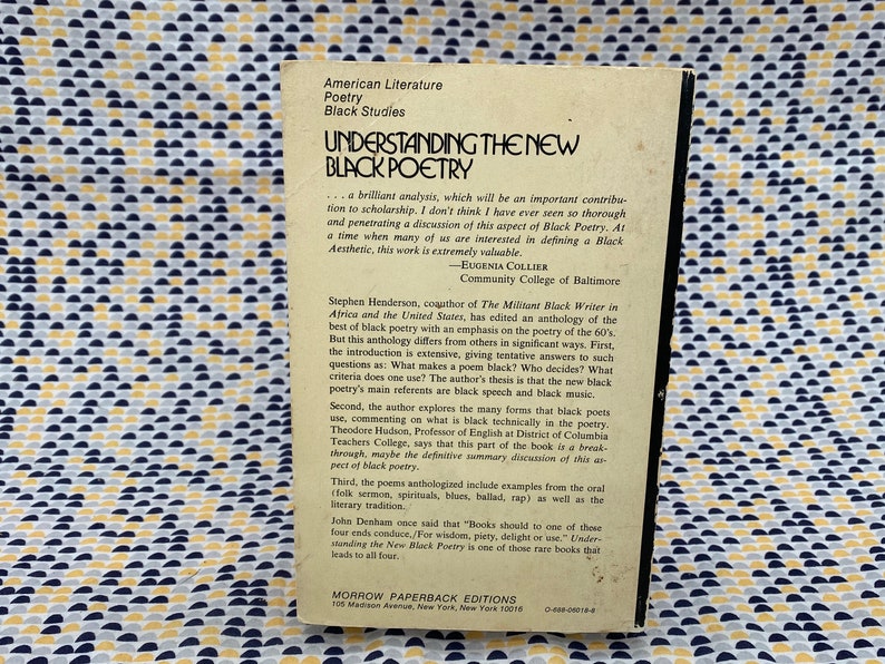 May include: A book cover with a white background and black text. The title is "Understanding the New Black Poetry". The book is part of the Morrow Paperback Editions series. The back cover features a quote from Eugenia Collier, Community College of Baltimore, and a summary of the book's contents.