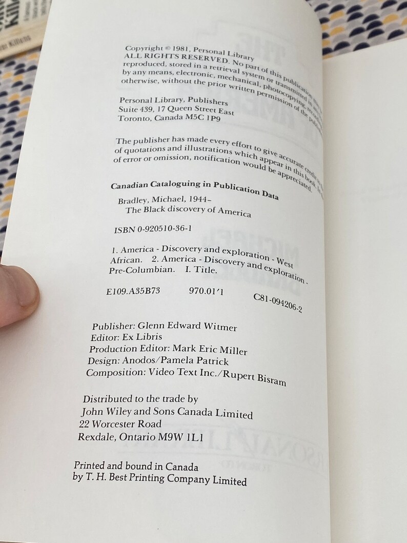 May include: Open book page with copyright information and text about "The Black Discovery of America" by Michael Bradley. The text includes the ISBN, publisher, and other publication details. The page is white with black text.
